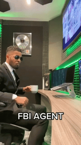 FBI agent spitting coffee at his monitor